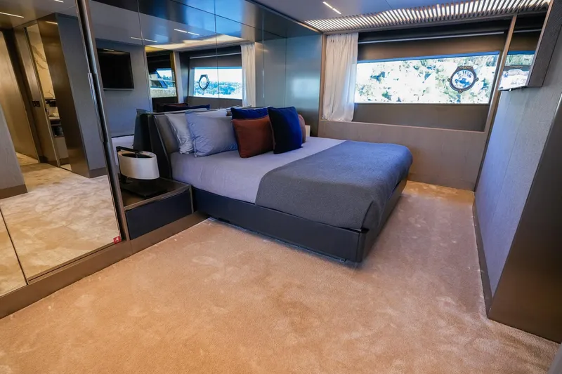 Toro Yacht Photos Pics Luxurious bedroom interior of 2017 Ferretti Yachts 850, featuring modern design and elegant furnishings.