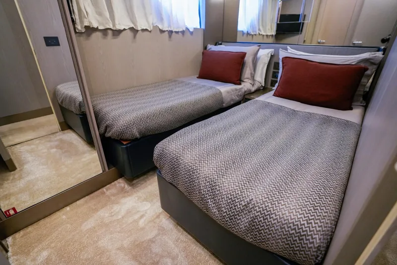 Toro Yacht Photos Pics Luxurious twin bedroom in 2017 Ferretti Yachts 850, featuring elegant decor and comfortable bedding.