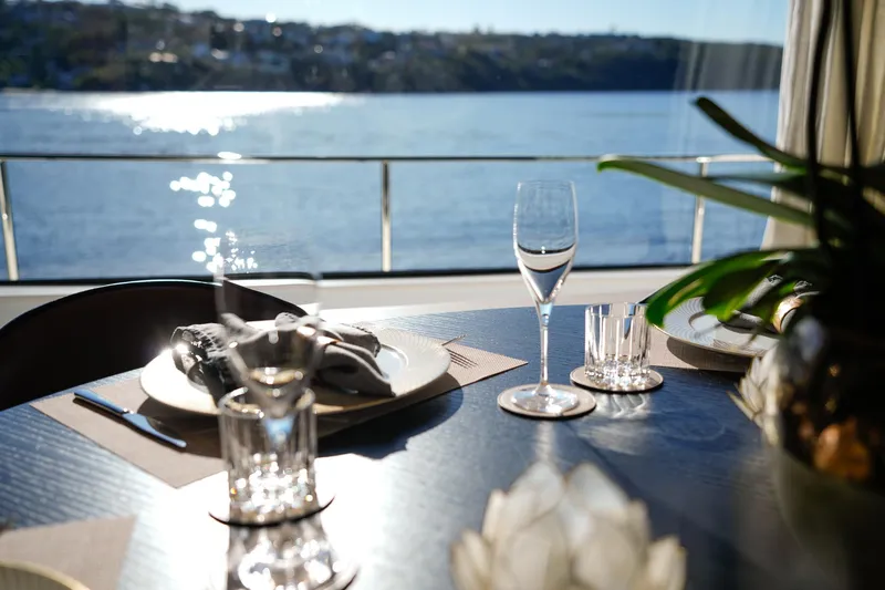 Toro Yacht Photos Pics Elegant dining setup on 2017 Ferretti Yachts 850 with ocean view.