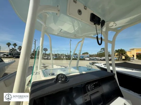  Yacht Photos Pics 2024 Sailfish 242 CC boat console with T-top and navigation equipment.
