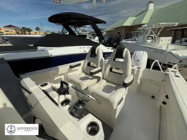  Yacht Photos Pics 2024 Sailfish 242 CC boat interior with dual seats and steering console.