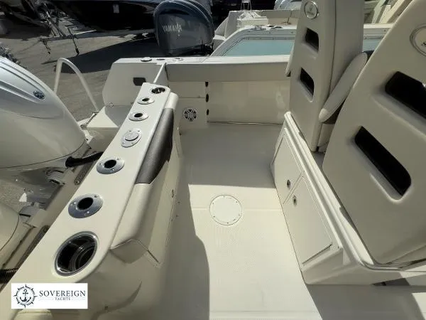  Yacht Photos Pics 2024 Sailfish 242 CC boat interior with seating and storage compartments.