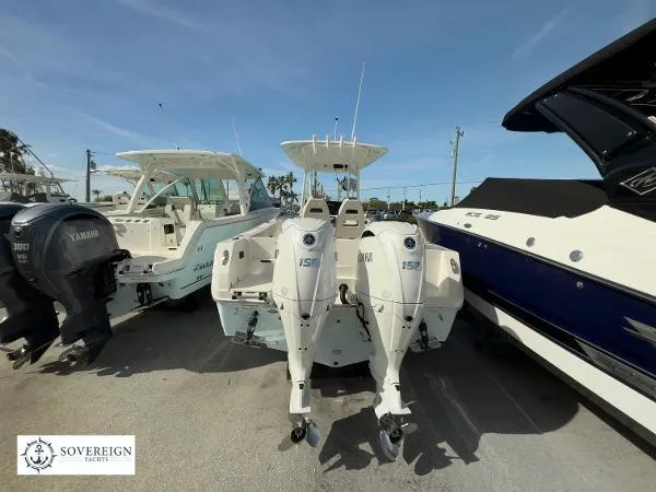  Yacht Photos Pics 2024 Sailfish 242 CC boat with twin outboard motors displayed at Sovereign Yachts.