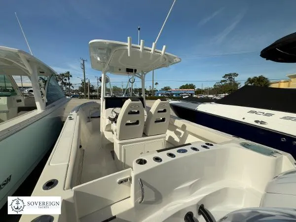  Yacht Photos Pics 2024 Sailfish 242 CC boat interior with dual seats and center console.