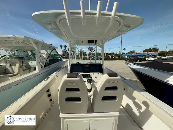  Yacht Photos Pics 2024 Sailfish 242 CC boat interior with dual seats and control panel, displayed at Sovereign Yacht.