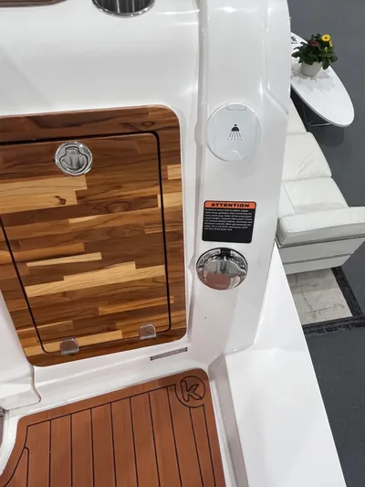  Yacht Photos Pics 2025 Ventura DayCruiser boat interior with wood accents and modern design.