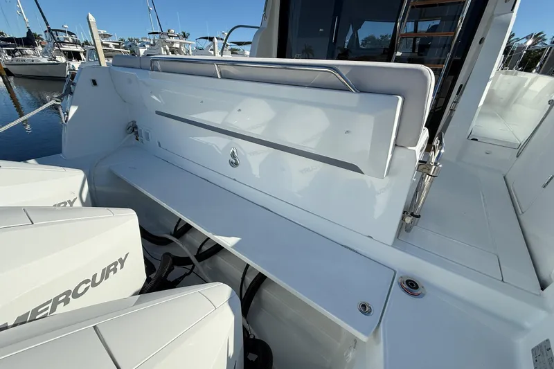  Yacht Photos Pics 2026 Beneteau Antares 12 boat deck with Mercury engines, docked at marina.