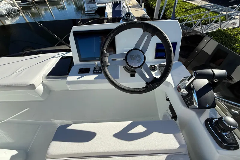  Yacht Photos Pics Helm of 2026 Beneteau Antares 12 with modern controls and navigation screens.