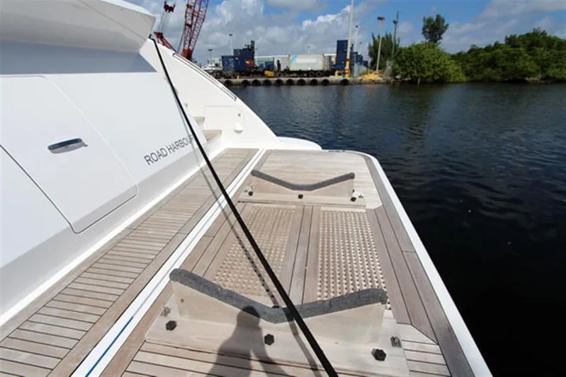 La Tache Yacht Photos Pics Azimut 100 Grande 2014 yacht deck with water and dock in the background.