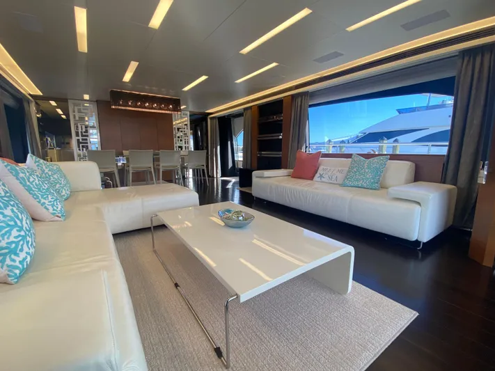 La Tache Yacht Photos Pics Luxurious interior of 2014 Azimut 100 Grande yacht with modern furnishings and large windows.