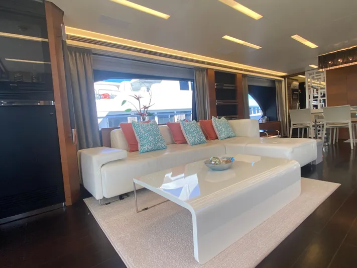 La Tache Yacht Photos Pics Luxurious interior of 2014 Azimut 100 Grande yacht with modern white sofa and sleek coffee table.