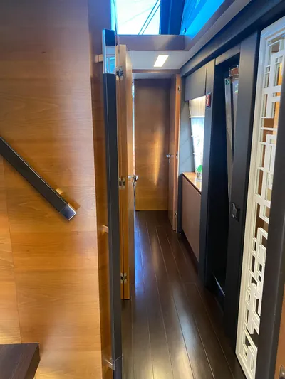 La Tache Yacht Photos Pics Interior hallway of 2014 Azimut 100 Grande yacht with wooden finishes.
