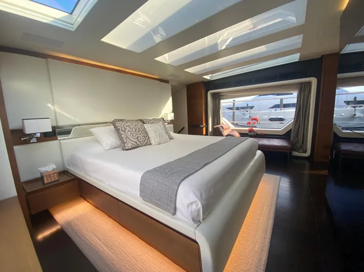 La Tache Yacht Photos Pics Luxurious bedroom interior of 2014 Azimut 100 Grande yacht with skylights and large windows.