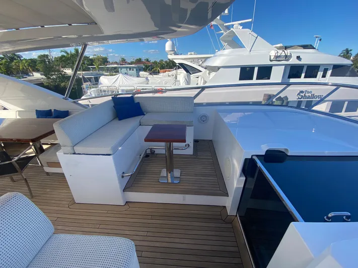 La Tache Yacht Photos Pics Luxurious deck of 2014 Azimut 100 Grande yacht with seating area and table.