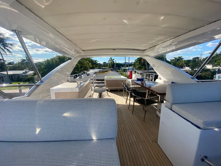La Tache Yacht Photos Pics 2014 Azimut 100 Grande yacht deck with seating and dining area.