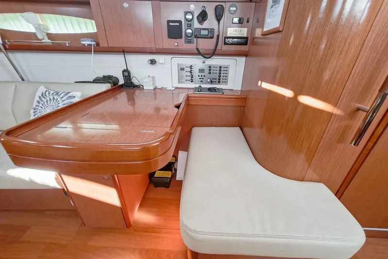  Yacht Photos Pics Interior of 2007 Beneteau 46 yacht with navigation station and seating area.