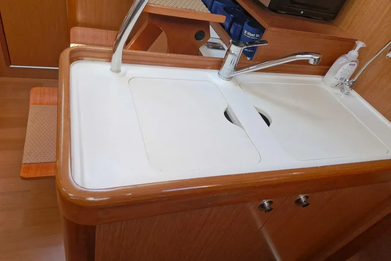  Yacht Photos Pics Galley sink area in 2007 Beneteau 46 yacht with wooden cabinetry.
