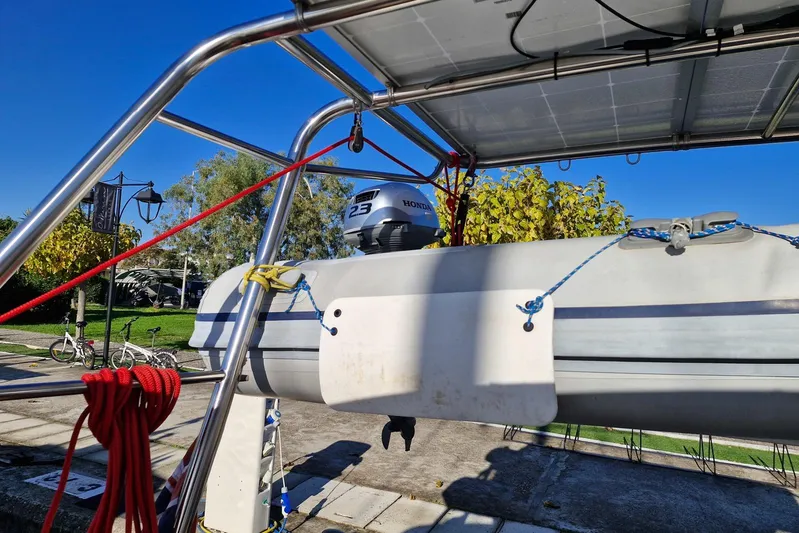  Yacht Photos Pics Beneteau 46 (2007) sailboat with Honda outboard motor and solar panels.