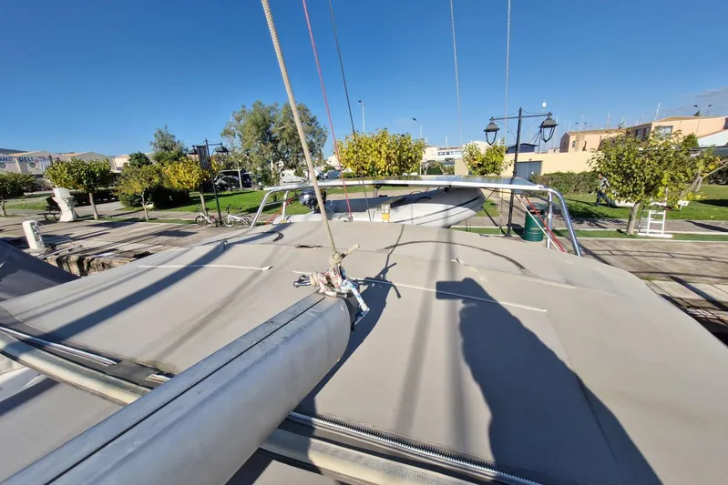  Yacht Photos Pics 2007 Beneteau 46 sailboat deck with rigging, docked in a sunny marina.