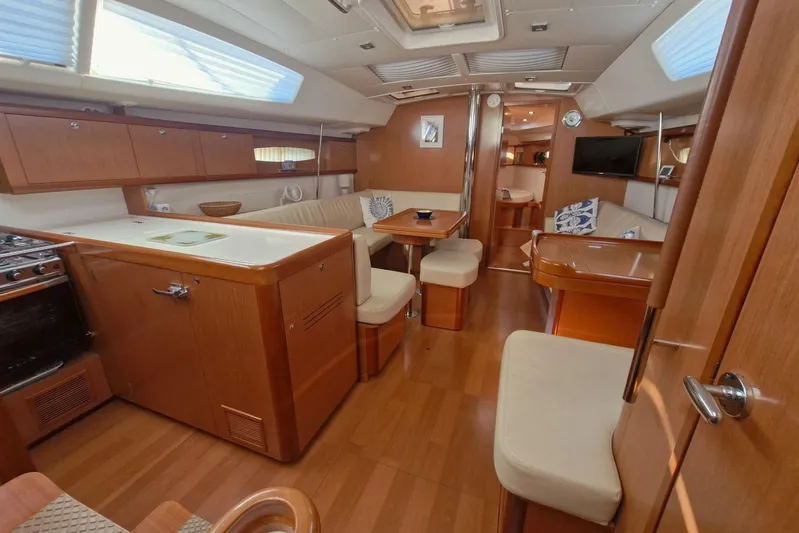  Yacht Photos Pics Luxurious interior of a 2007 Beneteau 46 yacht with wood finish and modern amenities.