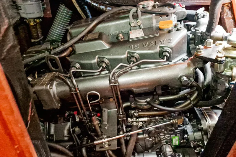  Yacht Photos Pics Engine compartment of a 2007 Beneteau 46 sailboat, showcasing a 16-valve engine.