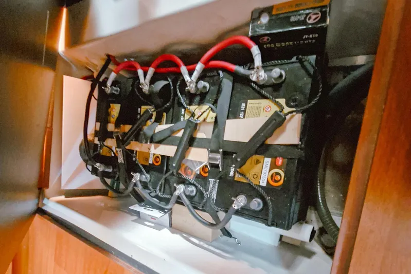  Yacht Photos Pics Battery compartment of a 2007 Beneteau 46 sailboat with connected cables.