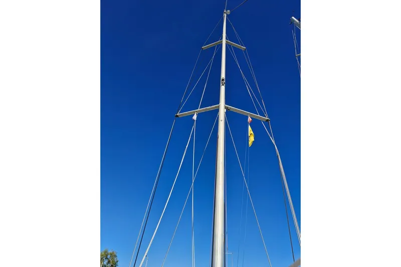  Yacht Photos Pics Mast of 2007 Beneteau 46 sailboat against clear blue sky.