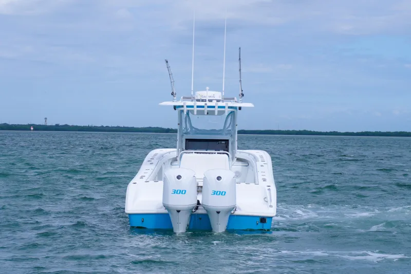  Yacht Photos Pics 2011 Yellowfin 32 Offshore boat with twin 300 engines on open water.