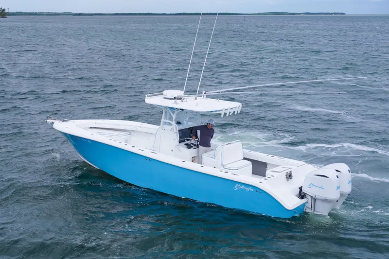  Yacht Photos Pics 2011 Yellowfin 32 Offshore boat cruising on open water.