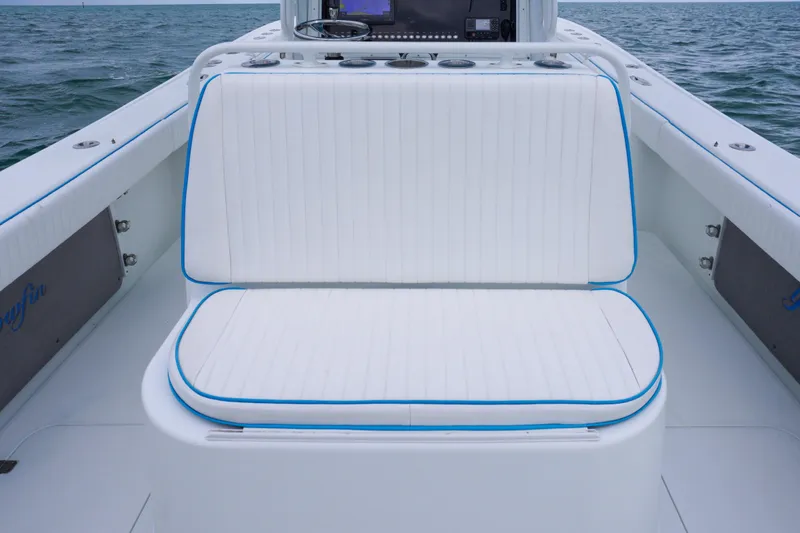  Yacht Photos Pics 2011 Yellowfin 32 Offshore boat interior with white cushioned seating.