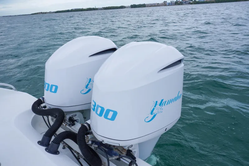  Yacht Photos Pics Twin outboard engines on a 2011 Yellowfin 32 Offshore boat in open water.