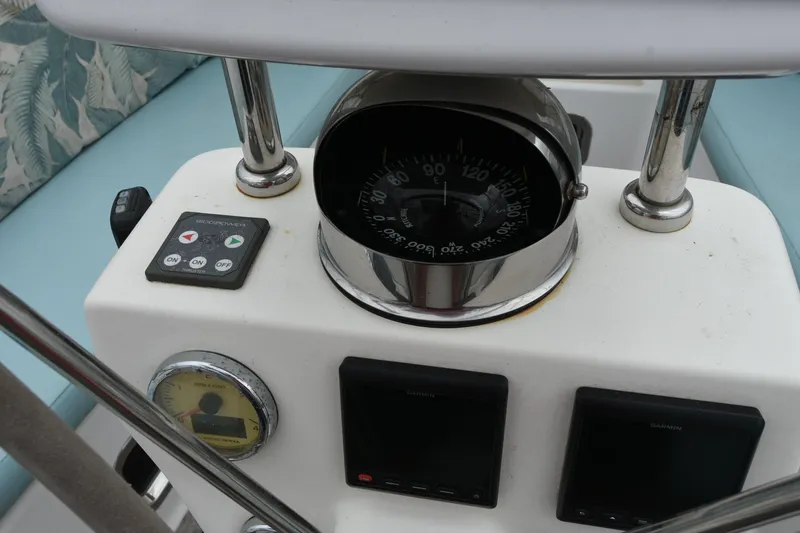 Makasi Yacht Photos Pics Cockpit of 2008 Tartan 4100 sailboat with compass and navigation controls.