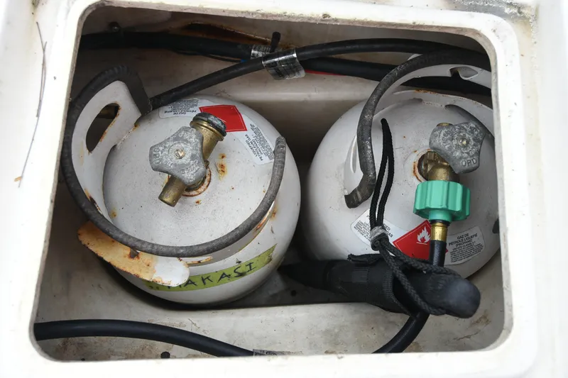 Makasi Yacht Photos Pics Two propane tanks in a Tartan 4100 yacht, 2008 model, with connected hoses.