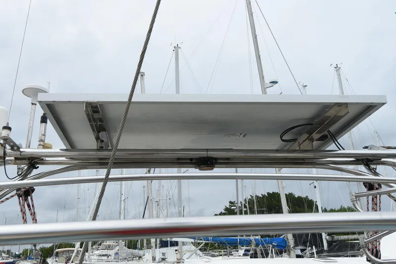 Makasi Yacht Photos Pics Solar panel on a 2008 Tartan 4100 sailboat, docked with masts in the background.