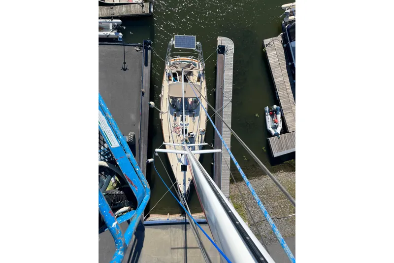 Makasi Yacht Photos Pics Aerial view of a 2008 Tartan 4100 sailboat docked at a marina.