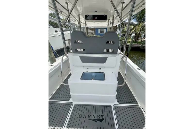  Yacht Photos Pics 2023 Garnet Offshore 300 HT boat interior with seating and deck view.