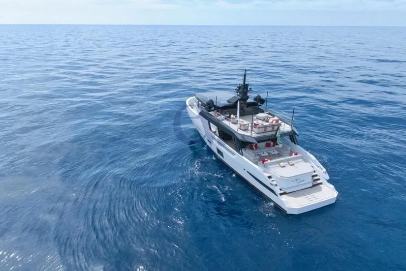 L Yacht Photos Pics 2024 Arcadia Yachts Sherpa 80XL cruising on open sea, aerial view.