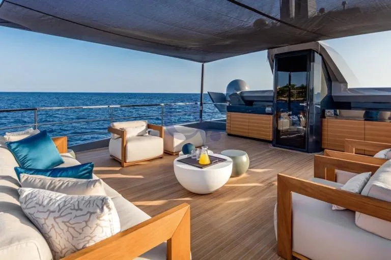 L Yacht Photos Pics Luxurious 2024 Arcadia Yachts Sherpa 80XL deck with modern seating and ocean view.