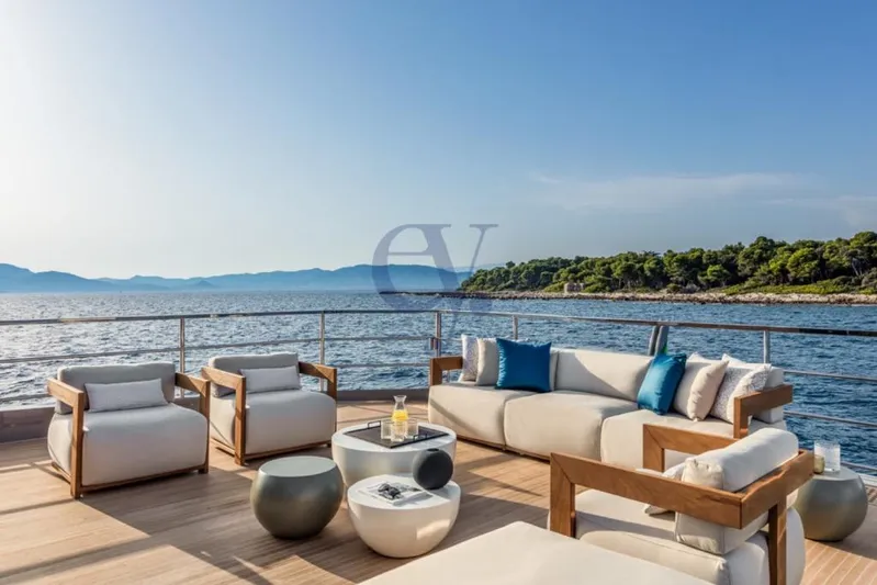 L Yacht Photos Pics Luxurious deck of 2024 Arcadia Yachts Sherpa 80XL with ocean view and elegant seating.