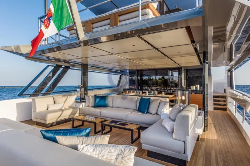 L Yacht Photos Pics Luxurious 2024 Arcadia Yachts Sherpa 80XL with elegant outdoor seating and ocean view.