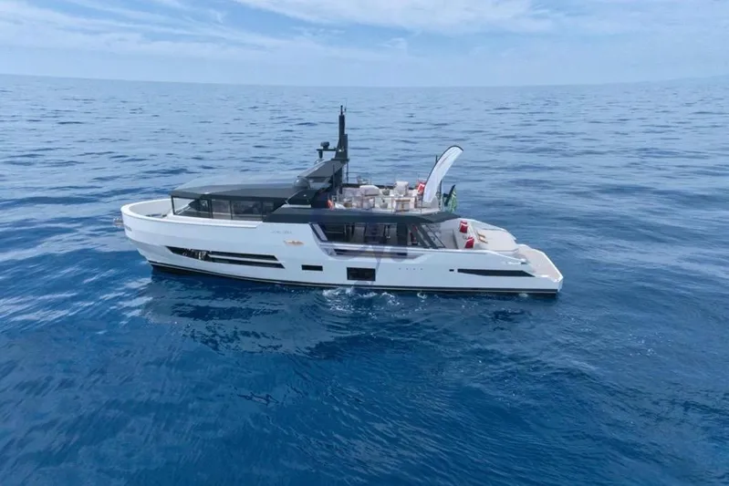 L Yacht Photos Pics 2024 Arcadia Yachts Sherpa 80XL cruising on open sea under clear skies.