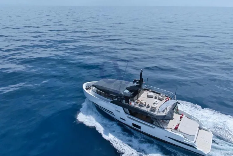 L Yacht Photos Pics 2024 Arcadia Yachts Sherpa 80XL cruising on open sea, aerial view.