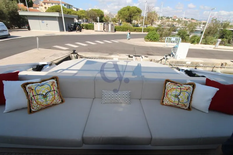 L Yacht Photos Pics Luxurious seating area on 2024 Arcadia Yachts Sherpa 80XL with decorative cushions.