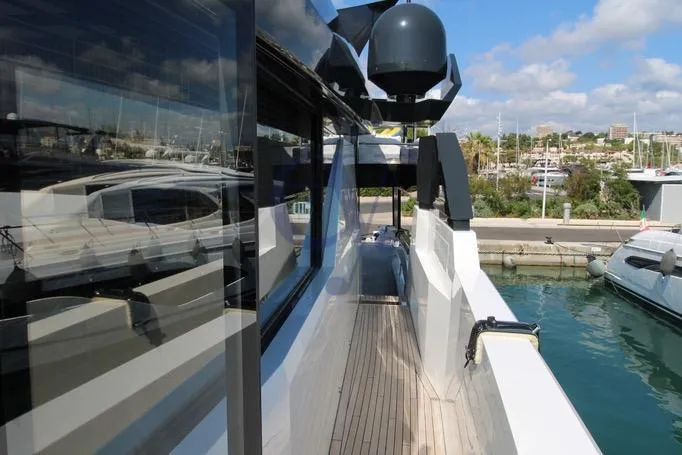 L Yacht Photos Pics 2024 Arcadia Yachts Sherpa 80XL docked, showcasing sleek design and modern features.
