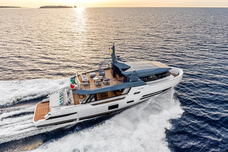 L Yacht Photos Pics 2024 Arcadia Yachts Sherpa 80XL cruising at sunset on open sea.