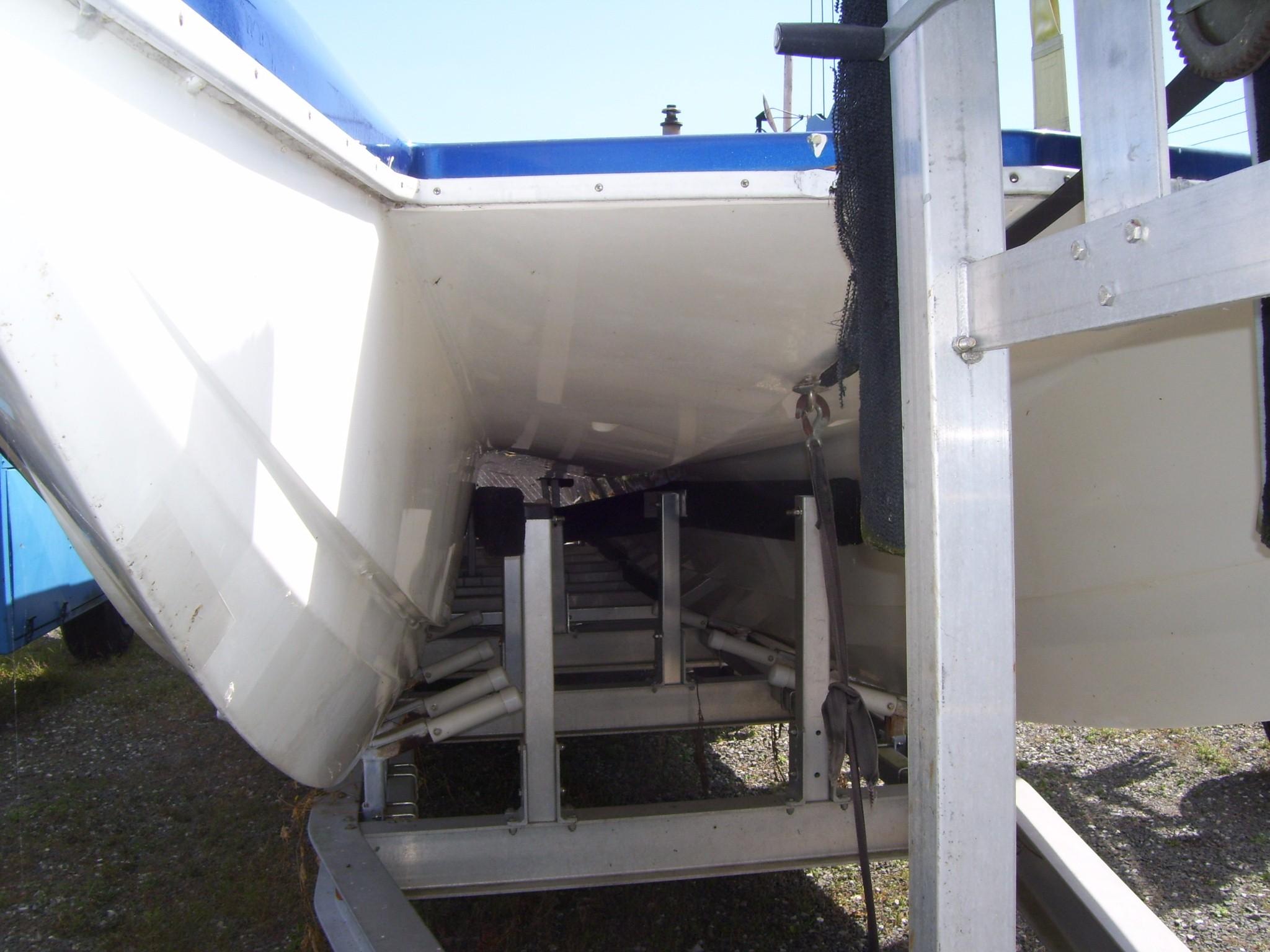 2002 Mares 38 High Performance boat on trailer, viewed from below.