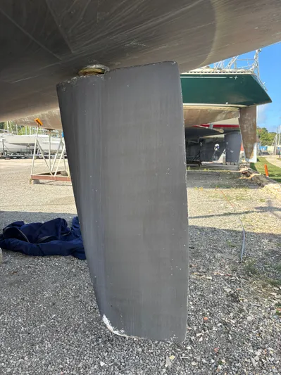 Renaissance Yacht Photos Pics Catalina 380 sailboat keel, 2000 model, on dry dock with clear blue sky.
