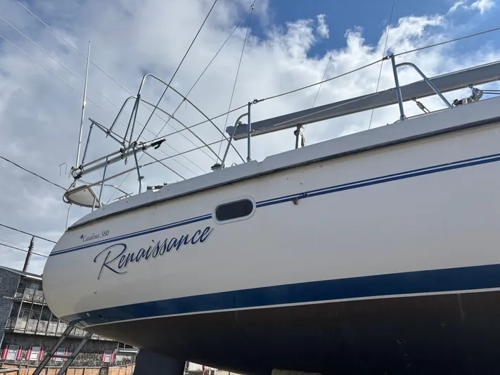 Renaissance Yacht Photos Pics Catalina 380 sailboat named "Renaissance" from 2000, docked under a cloudy sky.