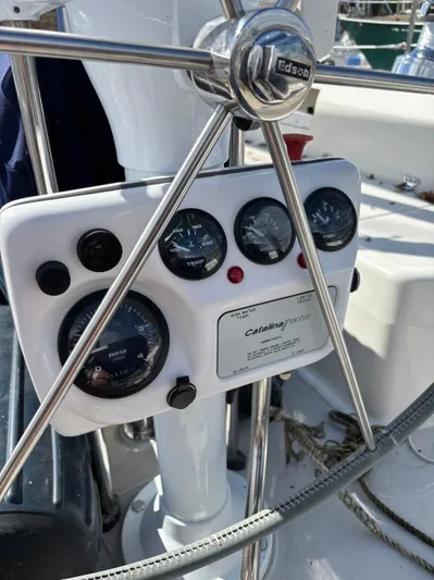 Renaissance Yacht Photos Pics Steering wheel and instrument panel of a 2000 Catalina 380 sailboat.