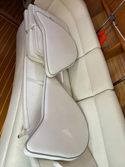 Renaissance Yacht Photos Pics Cushions on a Catalina 380 sailboat's interior seating, showcasing white upholstery.